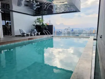 a swimming pool on the roof of a building at Isola KLCC Residence in Kuala Lumpur