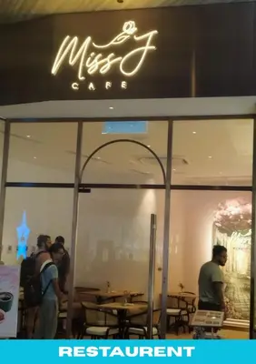 people standing in a restaurant with a sign on the window at Star Executive View KLCC in Kuala Lumpur