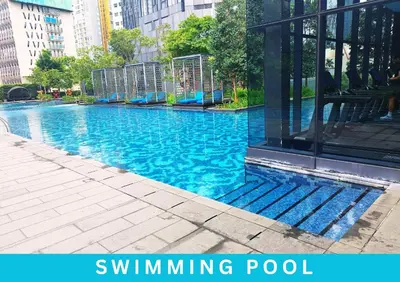 a swimming pool with a playground in a city at Star Executive View KLCC in Kuala Lumpur