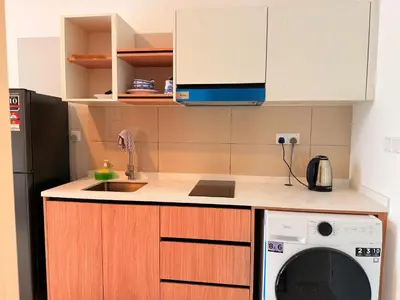 a kitchen with a microwave and a dishwasher at MH Rest House at Majestic Residence in Kuala Lumpur