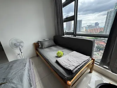 a bed in a room with a large window at Robertson S15 KLCC Alor Street Bukit Bintang 5Pax in Kuala Lumpur