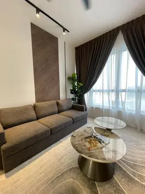 a living room with a couch and two tables at KL Nice Condo in Kuala Lumpur