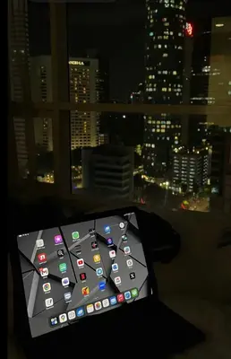 a remote control sitting in front of a window at Majestic Residence Klcc by Apple in Kuala Lumpur