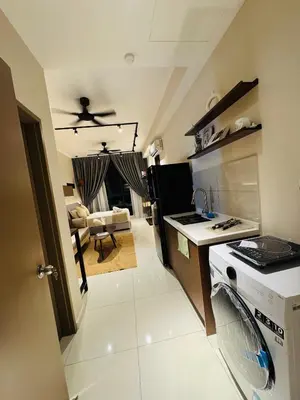 a kitchen with a stove and a counter top at Majestic Residence Klcc by Apple in Kuala Lumpur