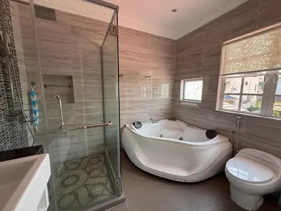 a bathroom with a tub and a toilet and a shower at Grand Luxe Bangalow 8BR, Ampang Utama Park, LRT in Ampang