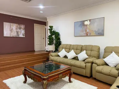 a living room with a couch and a coffee table at Grand Luxe Bangalow 8BR, Ampang Utama Park, LRT in Ampang