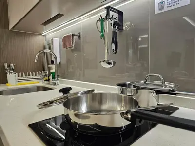 a kitchen with two pots and pans on the stove at Bukit Bintang Agile 400m to TRX DualKey 2-7pax in Kuala Lumpur