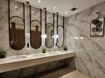 a bathroom with three sinks and three mirrors at Bukit Bintang Agile 400m to TRX DualKey 2-7pax in Kuala Lumpur