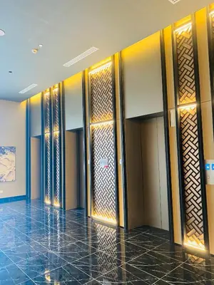 a lobby with wooden doors in a building at Majestic Residence KLCC by Nexus Suites in Kuala Lumpur