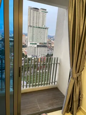 a balcony with a view of a city at INFINITUM Stay at klcc in Kuala Lumpur