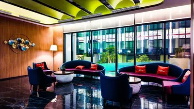 a lobby with couches and chairs in a building at Imperial Residence KLCC - MJ Home in Kuala Lumpur