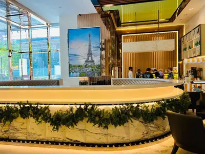 a restaurant with a view of the eiffel tower at Peace Pavilion At Platinum in Kuala Lumpur