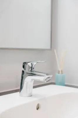 a bathroom sink with a chrome water faucet at Modern Cozy Home Kuala Lumpur, Agile Residence Bukit Bintang in Kuala Lumpur