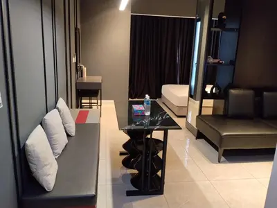a living room with a couch and a table at Unitopia near KLCC pavillion in Kuala Lumpur