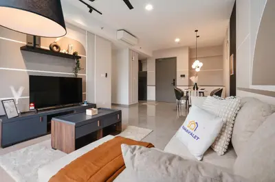 a living room with a couch and a tv at Grand 2BR Agile Bukit Bintang BY RumaBnB in Kuala Lumpur