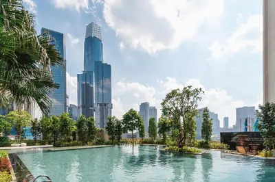 a swimming pool in a city with tall buildings at Grand 2BR Agile Bukit Bintang BY RumaBnB in Kuala Lumpur
