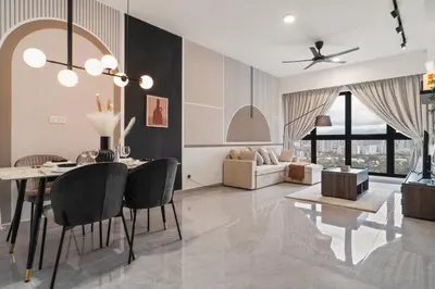 a dining room and living room with a table and chairs at Grand 2BR Agile Bukit Bintang BY RumaBnB in Kuala Lumpur