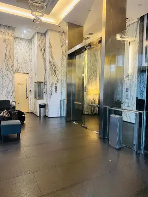 a lobby with a large glass wall in a building at Fairlane Bukit Bintang by Lily in Kuala Lumpur