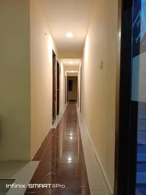 an empty hallway with a long corridor with a long hallway at SHAMA HoTEL in Kuala Lumpur