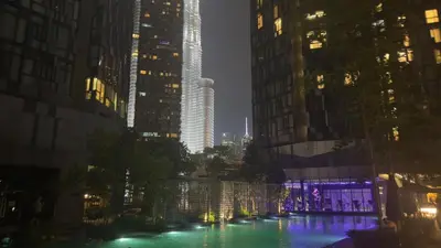 a pool of water in a city with tall buildings at KL Star Residance in Kuala Lumpur