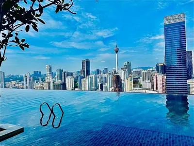 a swimming pool with a view of a city skyline at Supper Suite By Axon Residence in Kuala Lumpur
