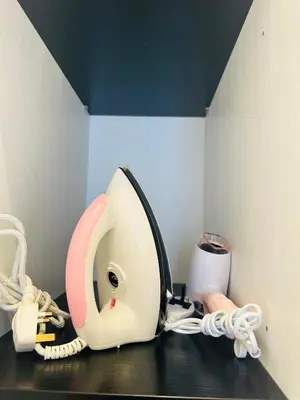a phone sitting on a counter in a room at Supper Suite By Axon Residence in Kuala Lumpur