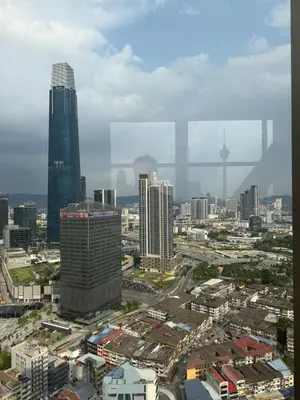 a city skyline with skyscrapers and buildings at Astra At Axon Bukit Bintang KL in Kuala Lumpur