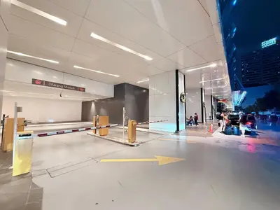an empty lobby of a building with people in it at Platinum Klcc by StayAura in Kuala Lumpur