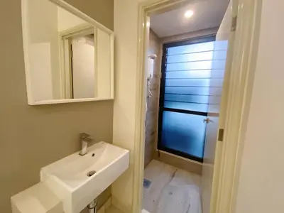 a bathroom with a sink and a mirror at Arte Mont Kiara by whitedoorz Apartment in Kuala Lumpur