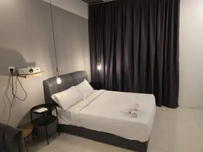 a bedroom with a bed with a teddy bear on it at Chambers residence klcc by Gajilion in Kuala Lumpur