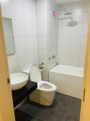 a bathroom with a toilet and a sink and a tub at Chambers residence klcc by Gajilion in Kuala Lumpur