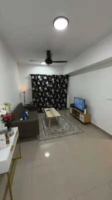a living room with a couch and a table at M Arisa Sentul KL City view in Kuala Lumpur