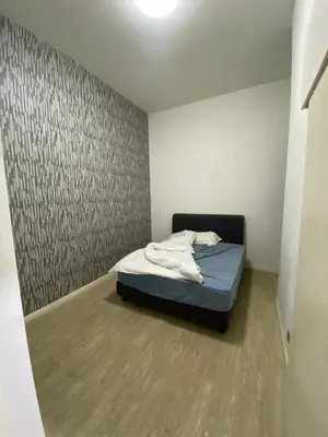 a small bedroom with a bed in a room at M-City, Jalan Ampang in Kuala Lumpur