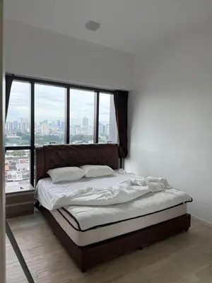 a bed in a room with a large window at M-City, Jalan Ampang in Kuala Lumpur