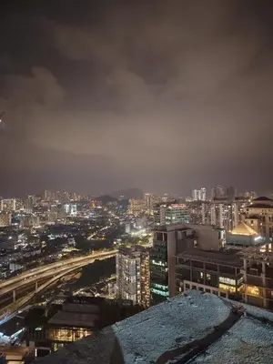 a view of a city at night at Scarletz Suites KLCC Twin Tower by Skyview in Kuala Lumpur