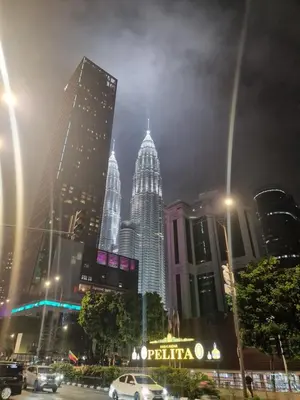 a city skyline at night with skyscrapers at Summer suites klcc 5 min walk by AA Global in Kuala Lumpur