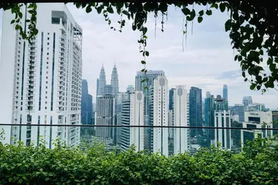a view of a city skyline with tall buildings at Majestic KLCC By Flora in Kuala Lumpur