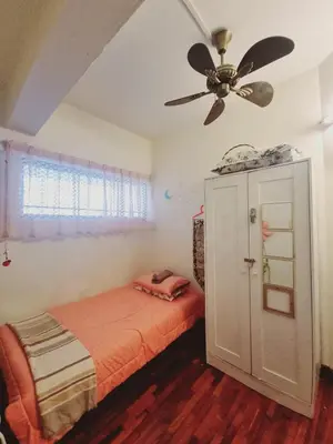 a bedroom with a bed and a ceiling fan at Shahana Homestay KL for musleem in Kuala Lumpur