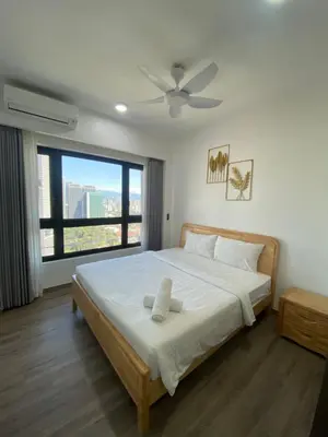 a bedroom with a large bed with a ceiling fan at Agile Bukit Bintang KL in Kuala Lumpur