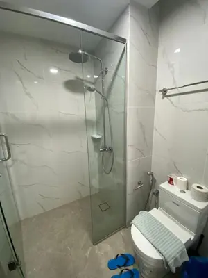 a bathroom with a glass shower with a toilet at Agile Bukit Bintang KL in Kuala Lumpur