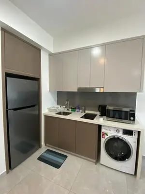 a kitchen with a washer and a dishwasher at Agile Bukit Bintang KL in Kuala Lumpur