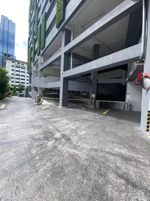 an empty parking lot in front of a building at Agile Bukit Bintang KL in Kuala Lumpur