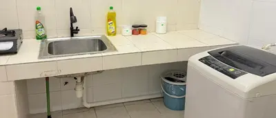 a kitchen with a sink and a counter top at Happy Homes Kuala Lumpur Rooms in Kuala Lumpur