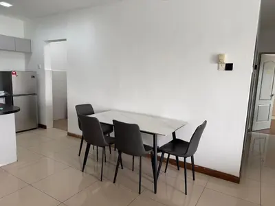a dining room table and chairs in a kitchen at Happy Homes Kuala Lumpur Rooms in Kuala Lumpur