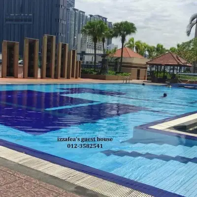 a large swimming pool in a city at Izzafea in Ampang