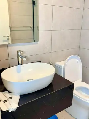 a bathroom with a sink and a toilet at Premium Executive Family Suites 3Bedroom at The Atrium Ampang by OKBnB in Kuala Lumpur