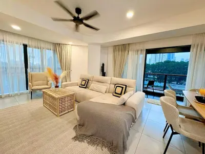 a living room with a couch and a ceiling fan at Premium Executive Family Suites 3Bedroom at The Atrium Ampang by OKBnB in Kuala Lumpur