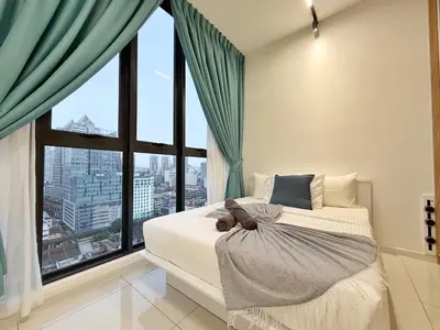 a bedroom with a bed with a large window at Majestic Unique Studio Suite with Infinity Pool in Kuala Lumpur