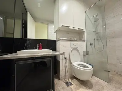 a bathroom with a toilet and a sink and a shower at White stone suites in Kuala Lumpur