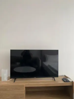 a flat screen tv sitting on top of a table at Agile Bukit Bintang Save Home in Kuala Lumpur